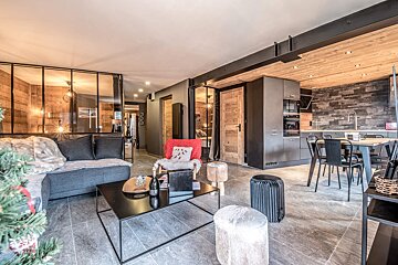 A living room with a couch and a coffee table