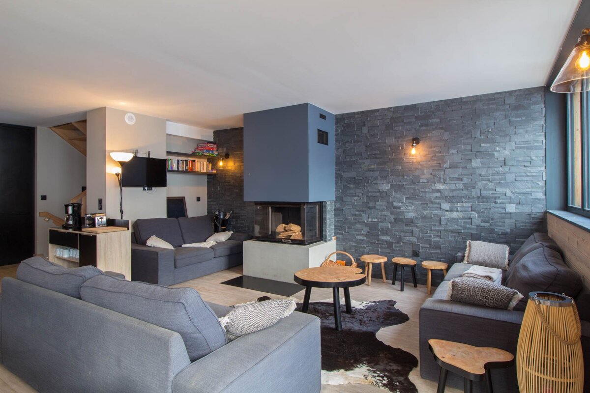 A living room with a couch and a fireplace