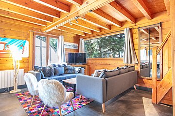 A living room with a couch and a television