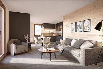 Cozy, modern living room with a grey sofa, wood-paneled wall, armchair, and an open kitchen and dining area in the background.