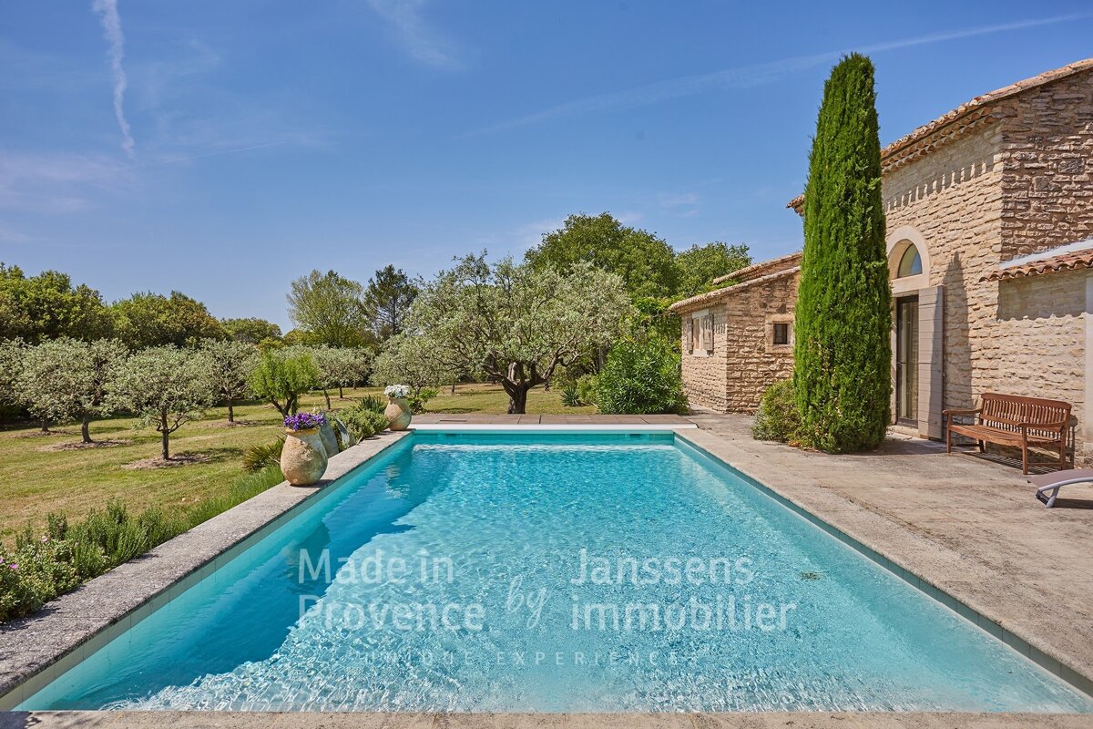 A large swimming pool with the words made in provence by immobilier on the bottom