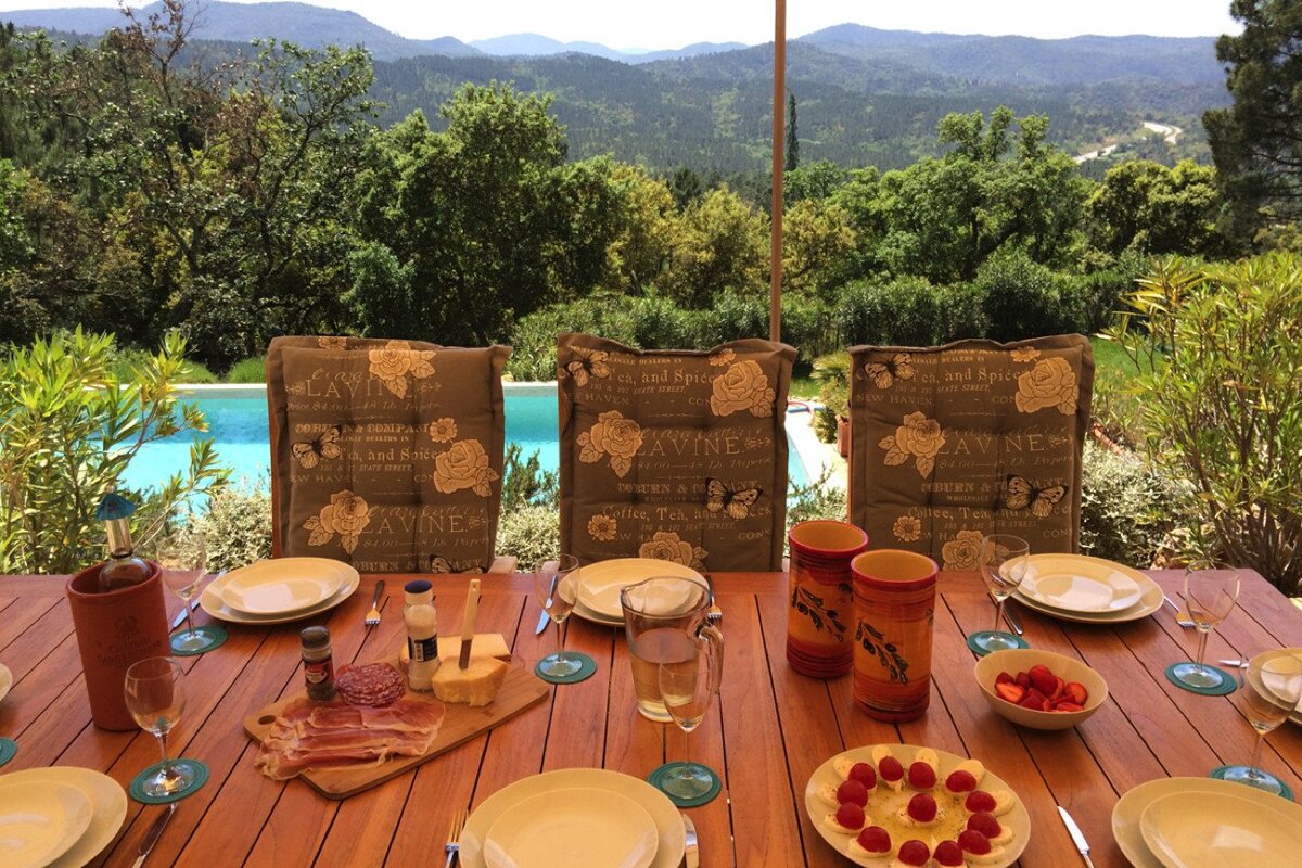 A table set for a meal with a view of the mountains