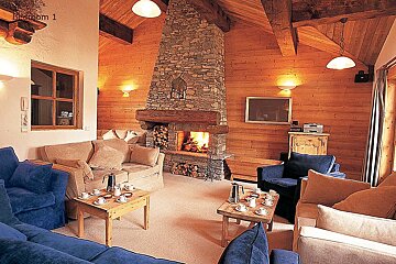 A living room with a fireplace and the words bedroom 1 above it