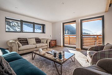 A living room with a couch and a coffee table