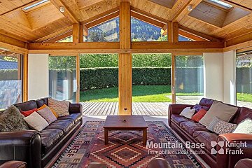 A living room with a couch and a rug that says mountain base on it