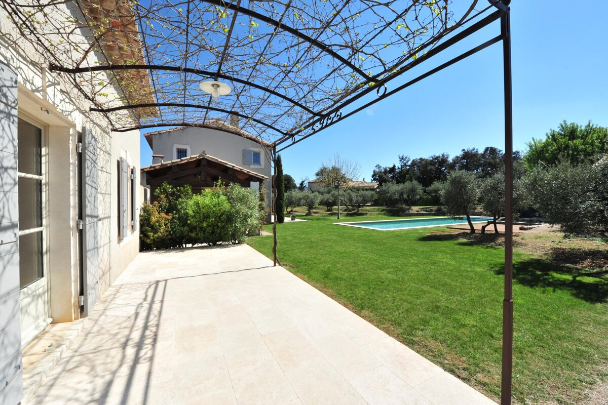 A large house with a swimming pool in the backyard