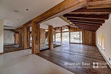 An empty room with a sign that says mountain base