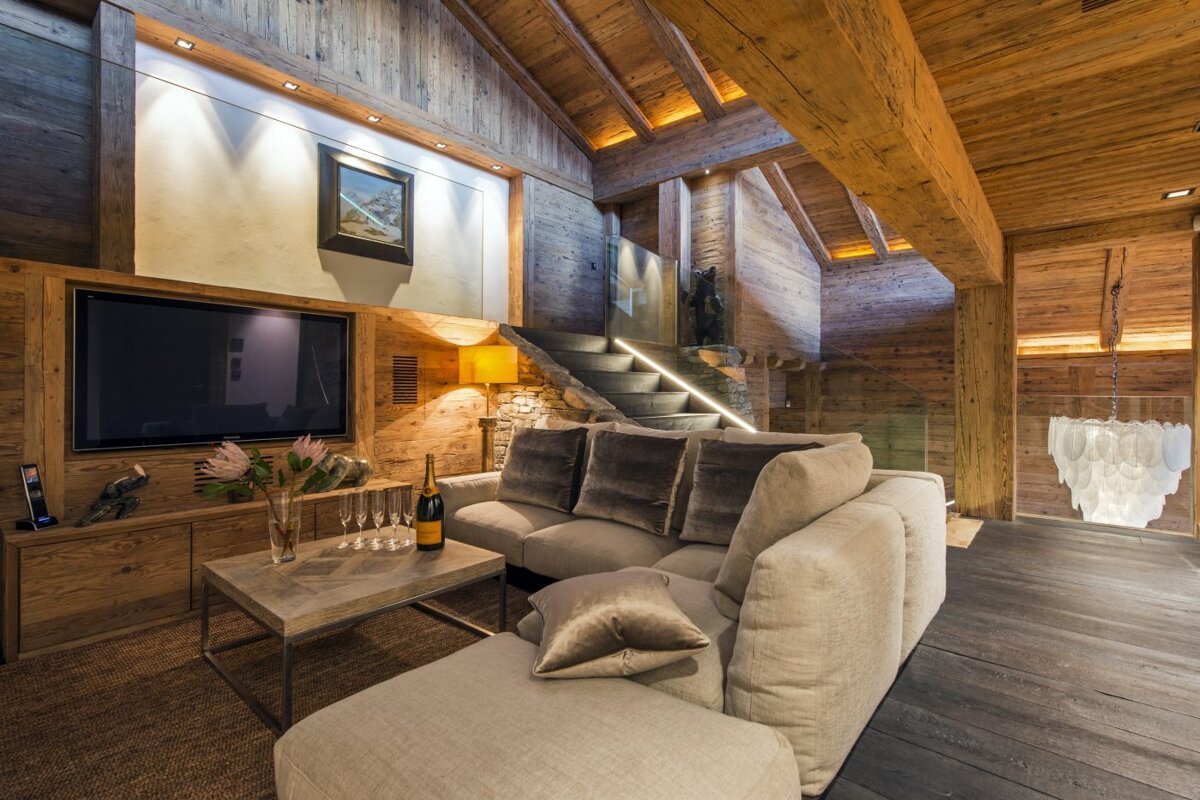 A living room with a couch and a flat screen tv