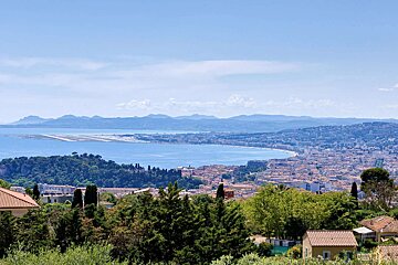 A view of a city with mountains in the background