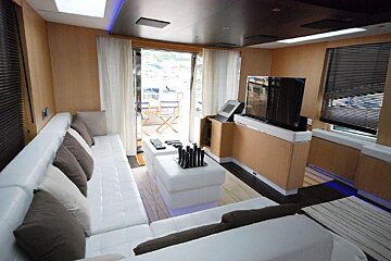 A living room with a couch and a flat screen tv