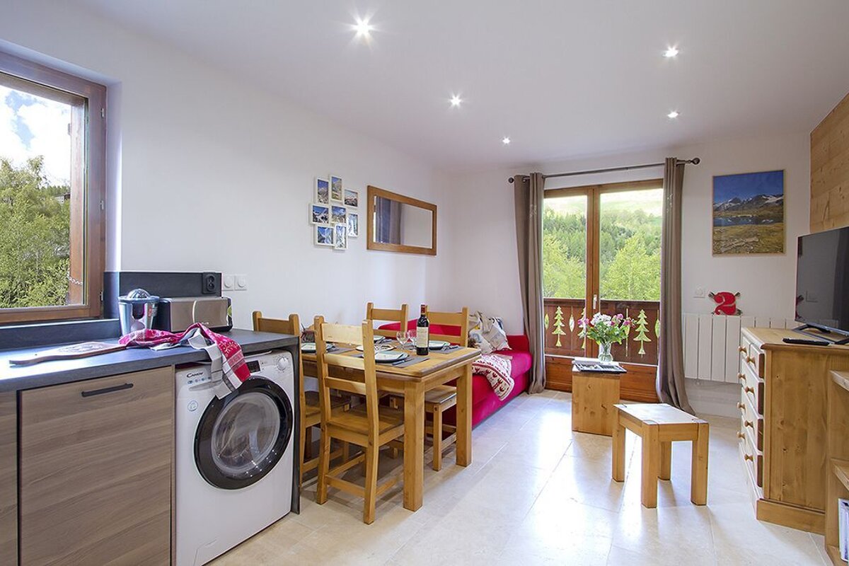 A kitchen with a candy brand washing machine