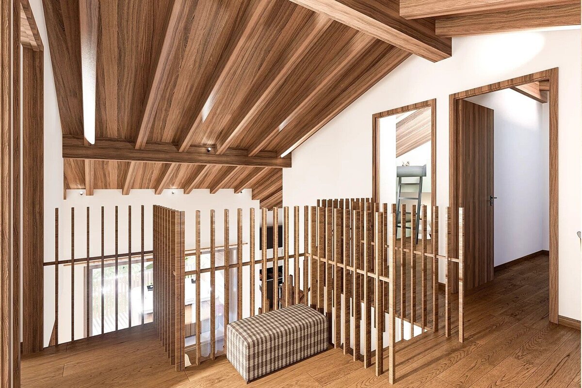 An inviting modern attic space showcases a striking slanted wooden plank ceiling, matching floors, and vertical slat railings, complemented by white walls and a mirror.