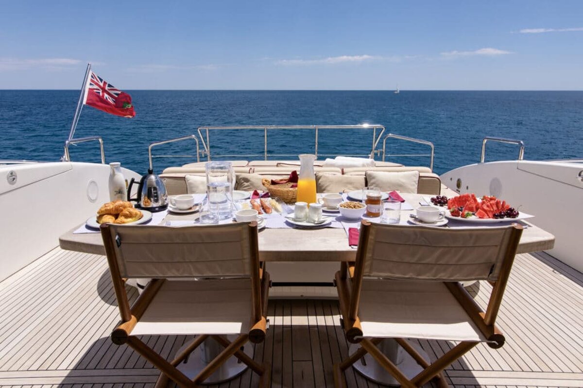 A british flag is flying over a table with food on it