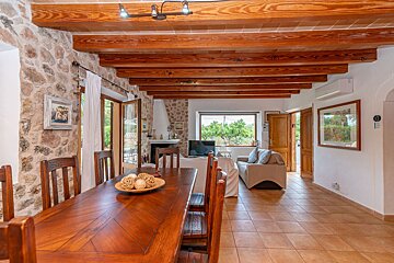 A wooden table and chairs in a living room