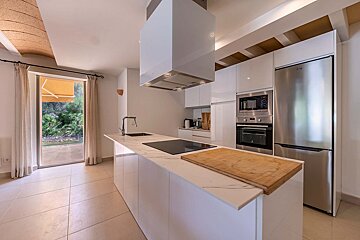 A kitchen with a stainless steel refrigerator that says lg on it