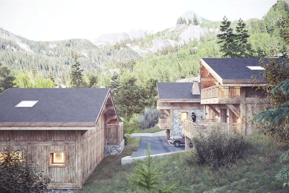 A car is parked in front of a house in the woods
