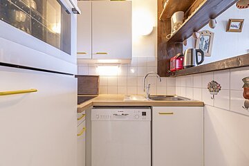 A kitchen with a bosch dishwasher and a sink