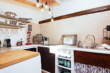 A kitchen with a sign on the wall that says coffee