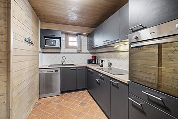 A kitchen with a stainless steel candy oven