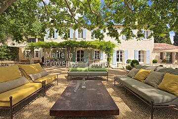 A patio area with a house in the background and the words made in provence