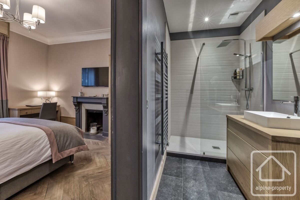 A bathroom with the word alpine property on the corner