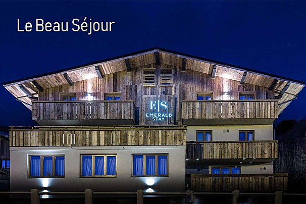 The emerald star hotel is lit up at night