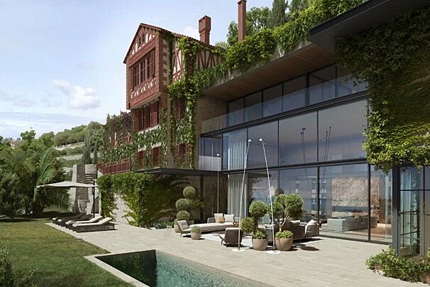 Luxurious hillside villa blending classic brick with modern glass design, featuring a lush garden, pool, and outdoor lounge area.