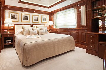A bedroom with a large bed and a tray on it
