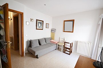 A living room with a couch and a chair