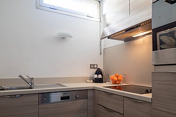 A kitchen with a stainless steel appliance that says ' philips ' on it