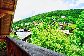 A view of a mountain village from a balcony