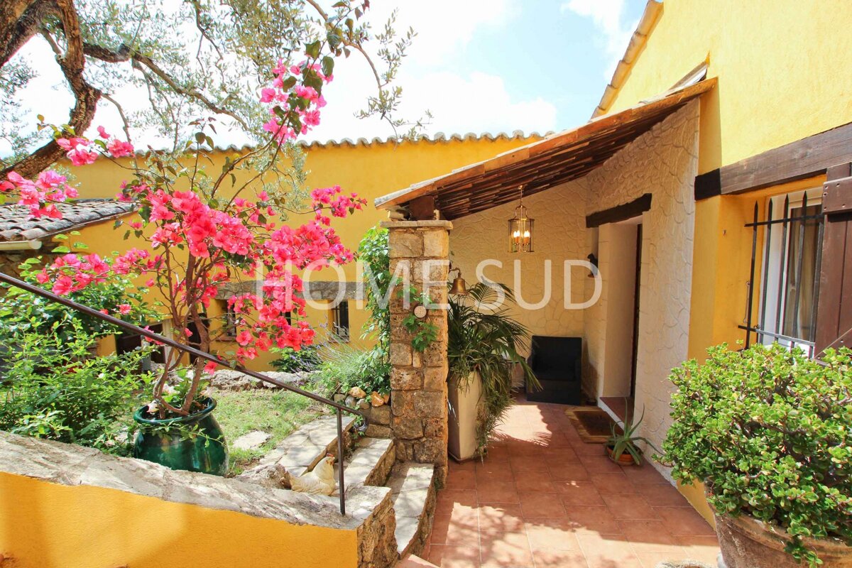 A house with a sign that says home sud on it