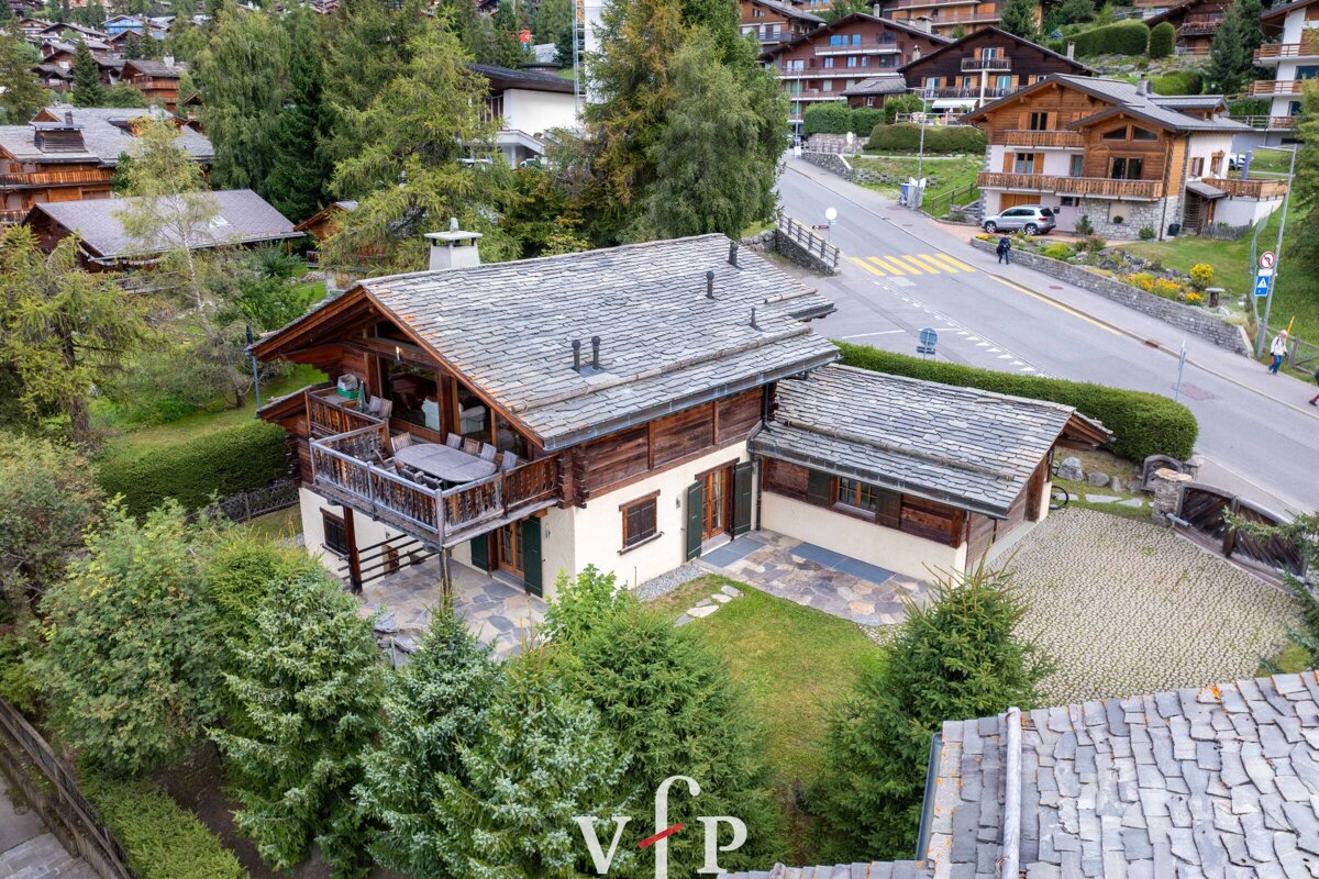 An aerial view of a house with the letters vfp on the roof