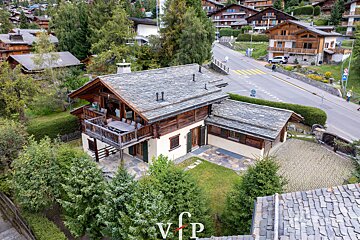 An aerial view of a house with the letters vfp on the roof