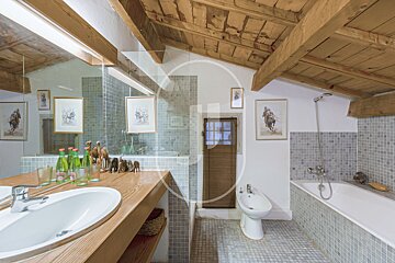 A bathroom with a sink a bidet and a bathtub