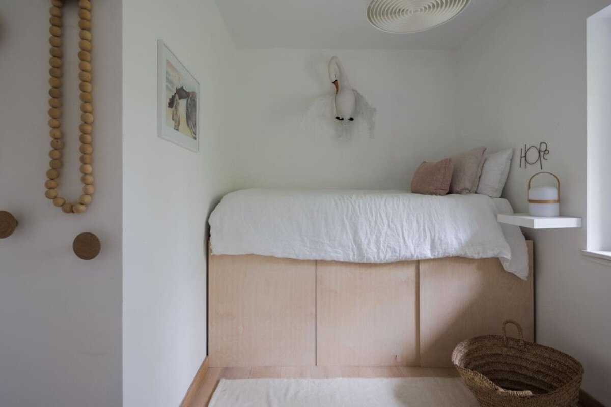 A bedroom with a bed and a sign that says hope