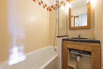 A bathroom with a sink and a bathtub