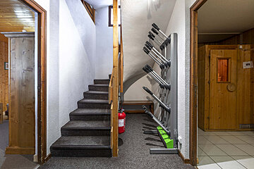 A staircase with a fire extinguisher next to it
