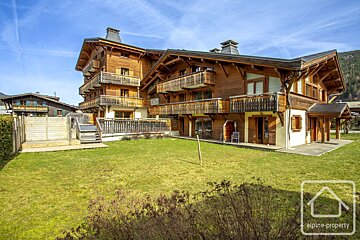 A large house with alpine property written on it