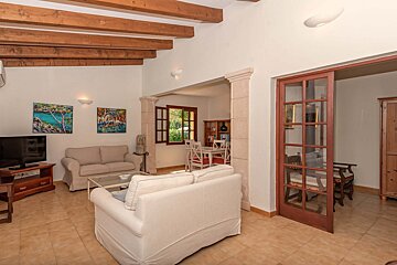 A living room with a couch and a television