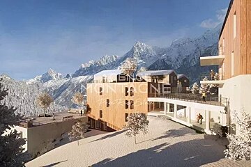 An artist 's impression of a hotel in the mountains