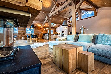A living room with a couch and a fireplace