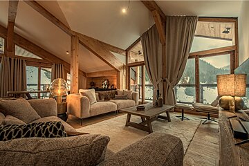 A bedroom with a picture on the wall above the bed