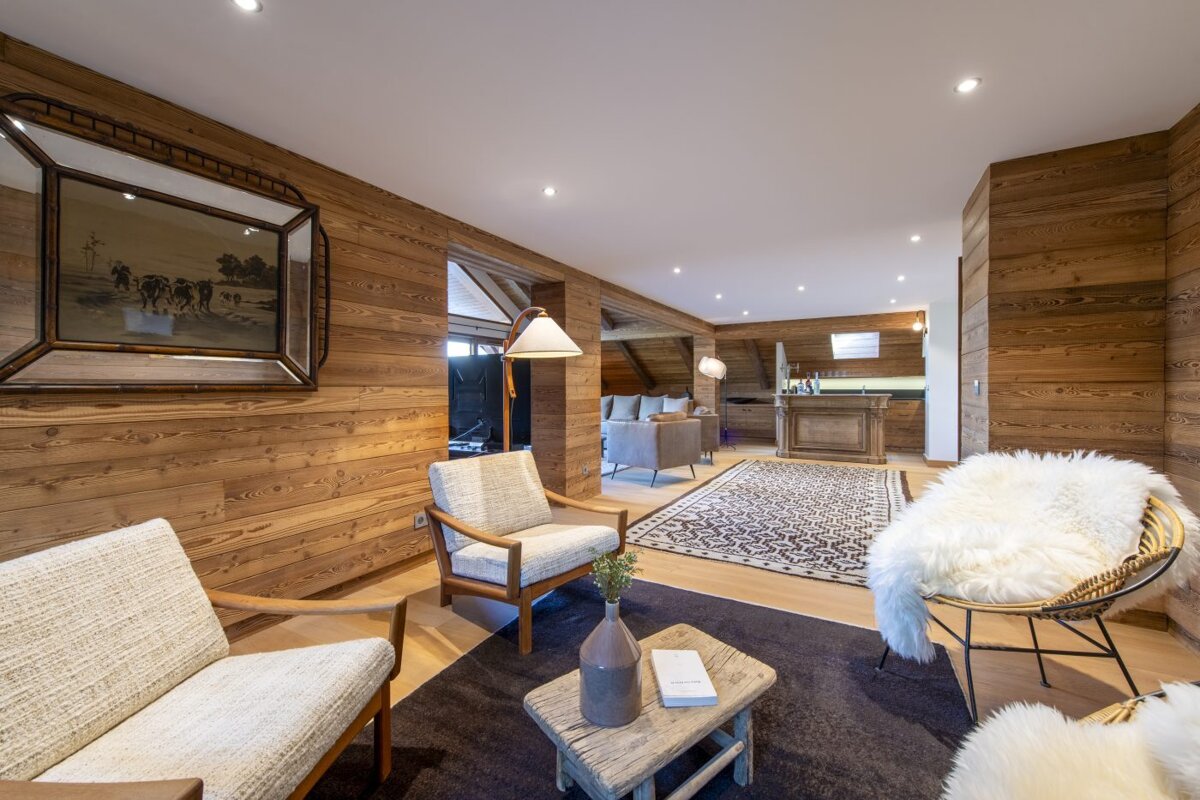 A living room with two chairs and a table