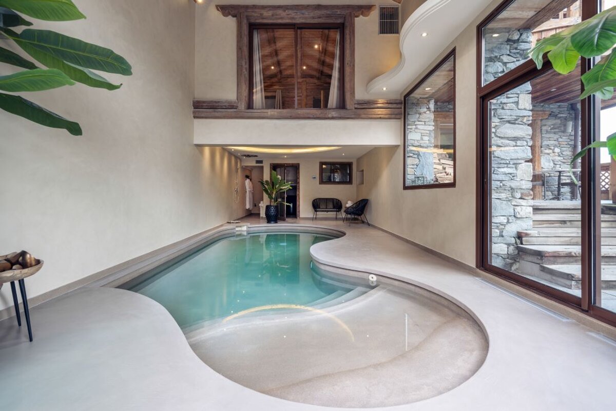 A large indoor swimming pool in a house