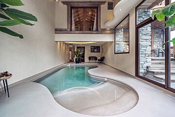 A large indoor swimming pool in a house