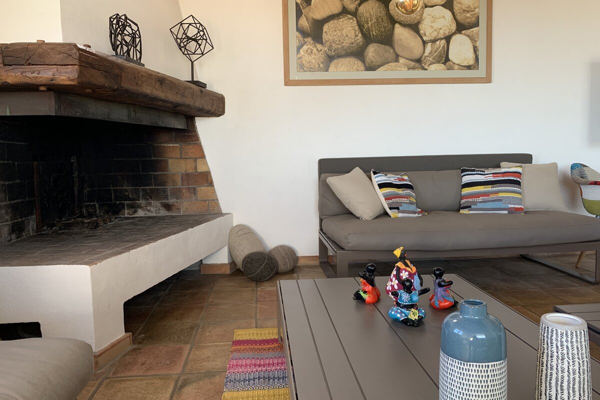 A living room with a fireplace and a couch