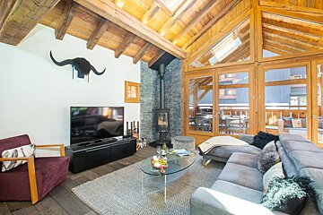 A living room with a couch and a flat screen tv
