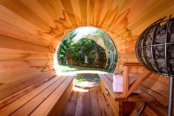 The inside of a wooden sauna with a large window