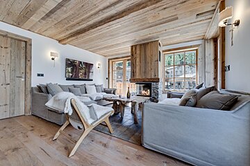 A living room with a fireplace and a couch